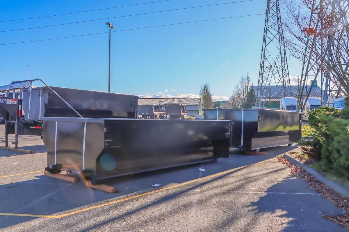 Roll-off dumpster ready for waste disposal at job site for 4 Yard Dumpster Rental in The Village